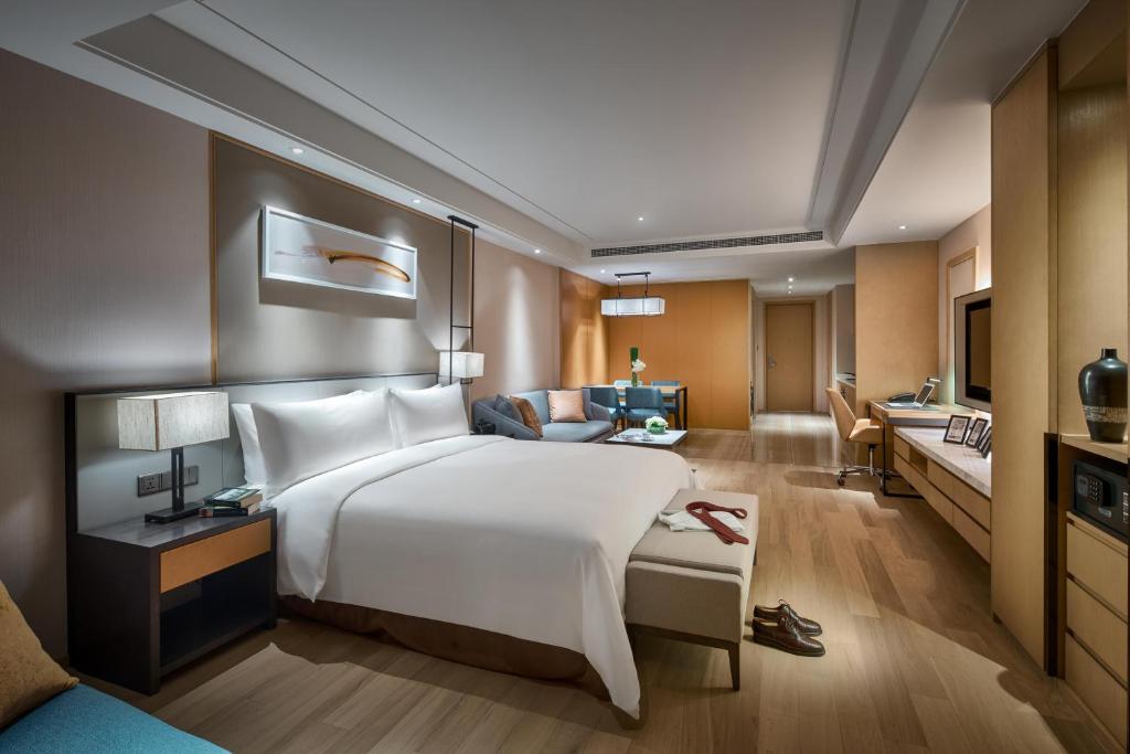 Postel nebo postele na pokoji v ubytování Primus Residence Shanghai Hongqiao