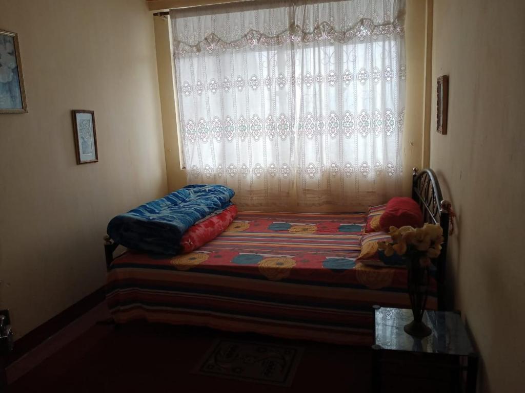 Postel nebo postele na pokoji v ubytování Backpackers Hostel