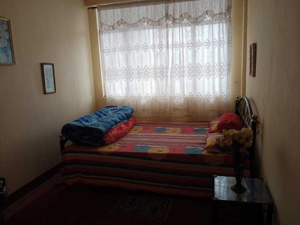 Postel nebo postele na pokoji v ubytování Backpackers Hostel
