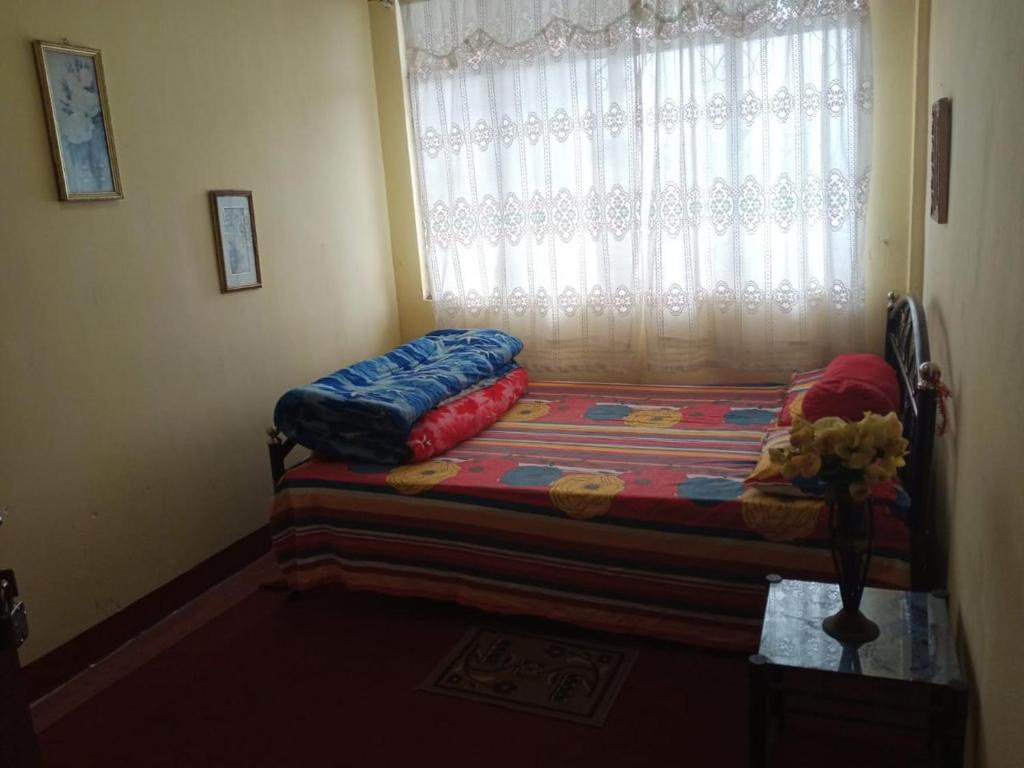 Postel nebo postele na pokoji v ubytování Backpackers Hostel
