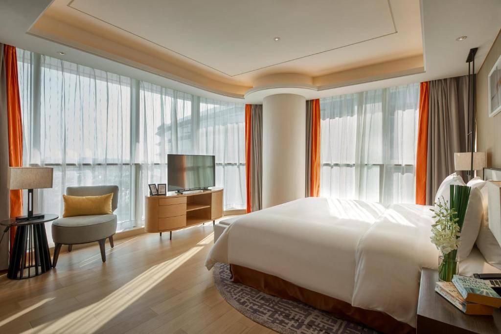 Postel nebo postele na pokoji v ubytování Primus Residence Shanghai Hongqiao