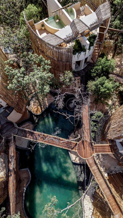 an overhead view of a water park with a pool at Taio Tulum in Tulum