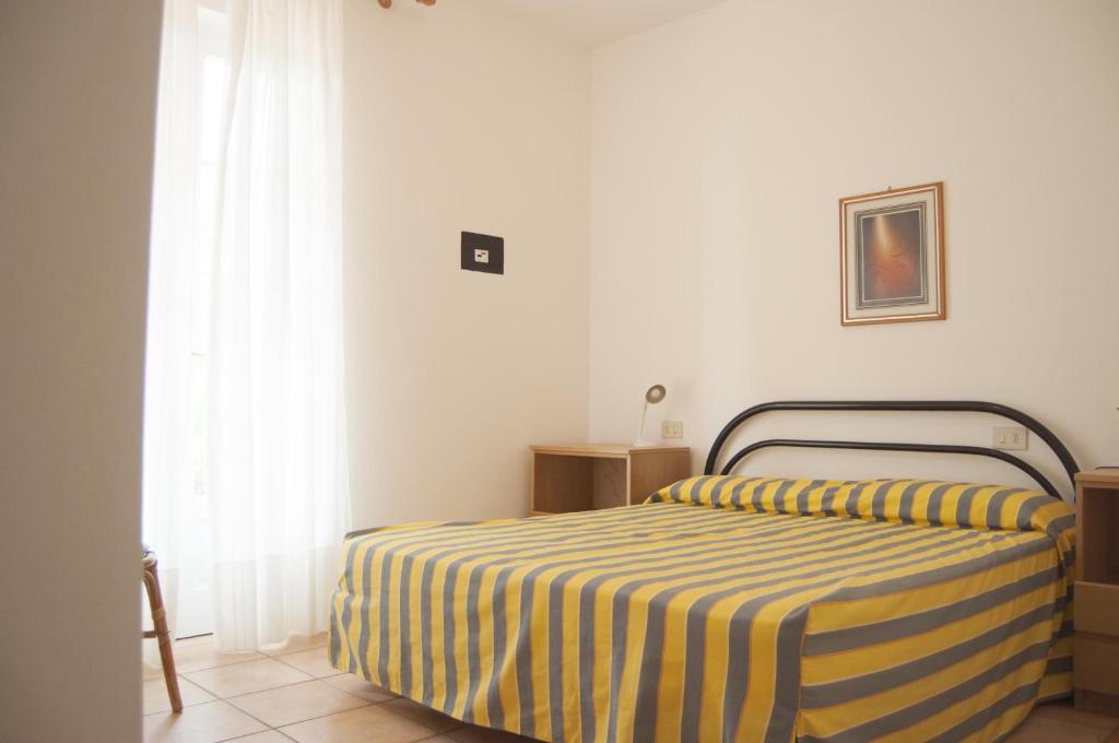Postel nebo postele na pokoji v ubytování Residence Le Mimose