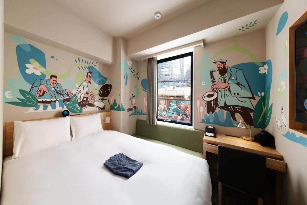 Postel nebo postele na pokoji v ubytování HOTEL Enmichi