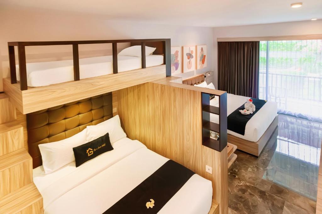 Postel nebo postele na pokoji v ubytování Graha Socio Hotel Nusa Dua Bali