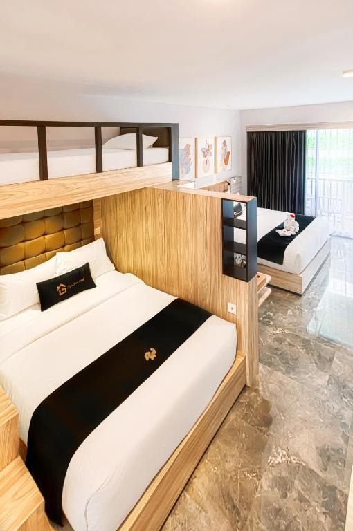 Postel nebo postele na pokoji v ubytování Graha Socio Hotel Nusa Dua Bali