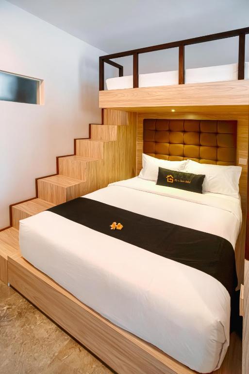 Postel nebo postele na pokoji v ubytování Graha Socio Hotel Nusa Dua Bali