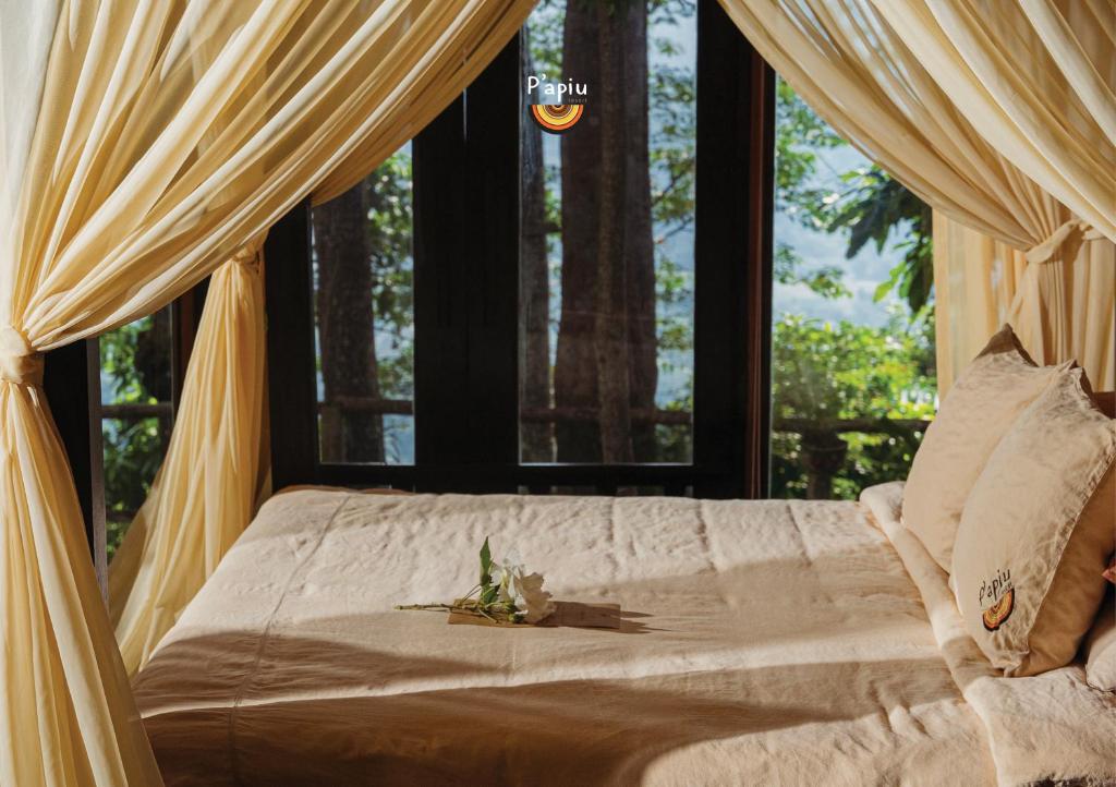Postel nebo postele na pokoji v ubytování P'apiu Resort
