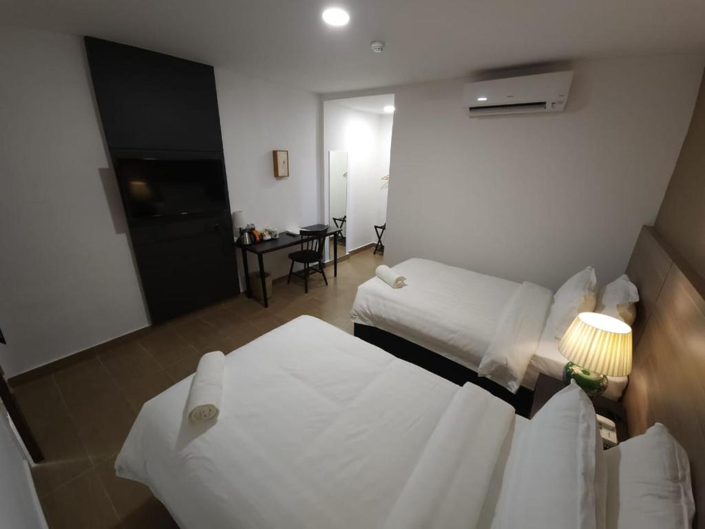 Postel nebo postele na pokoji v ubytování Yu Hotel Chinatown