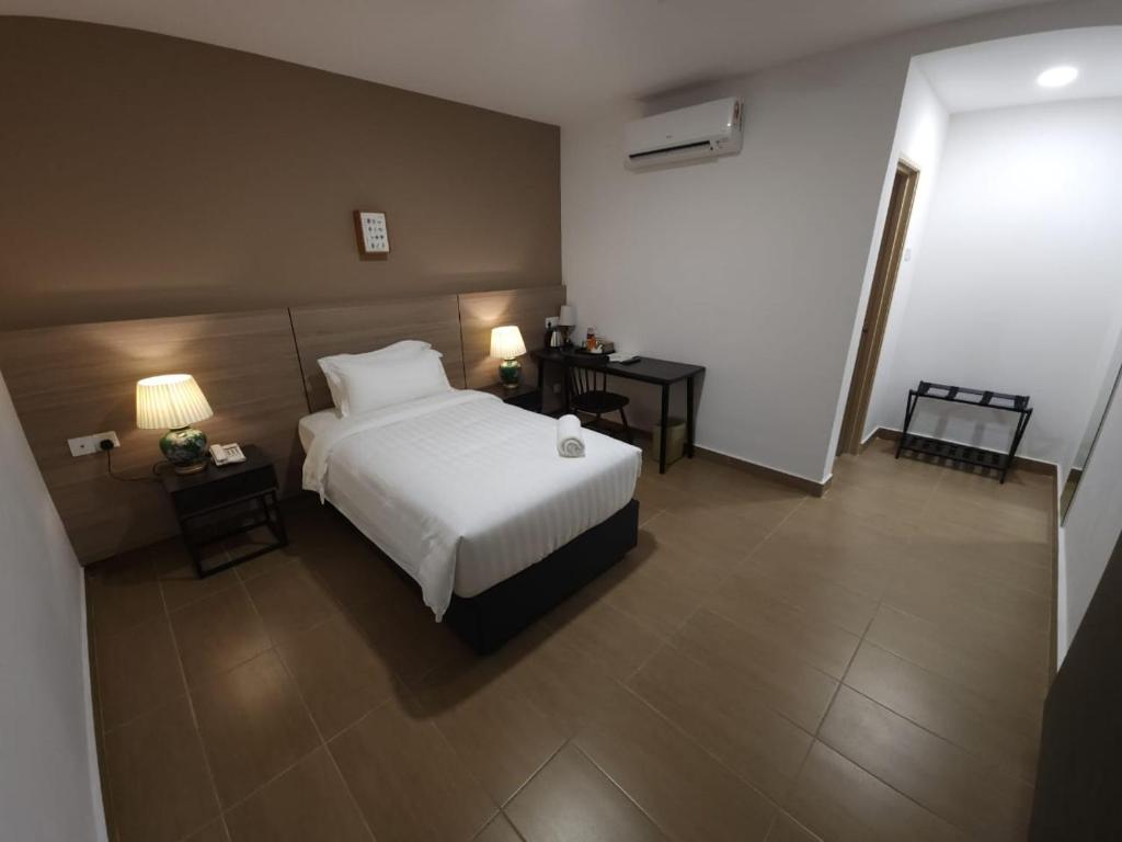 Postel nebo postele na pokoji v ubytování Yu Hotel Chinatown