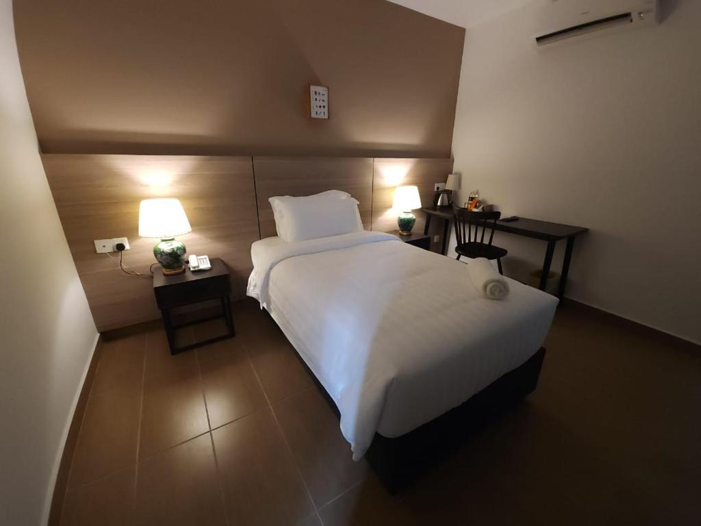 Postel nebo postele na pokoji v ubytování Yu Hotel Chinatown