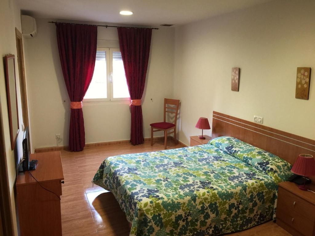 Posteľ alebo postele v izbe v ubytovaní Hotel Godofredo