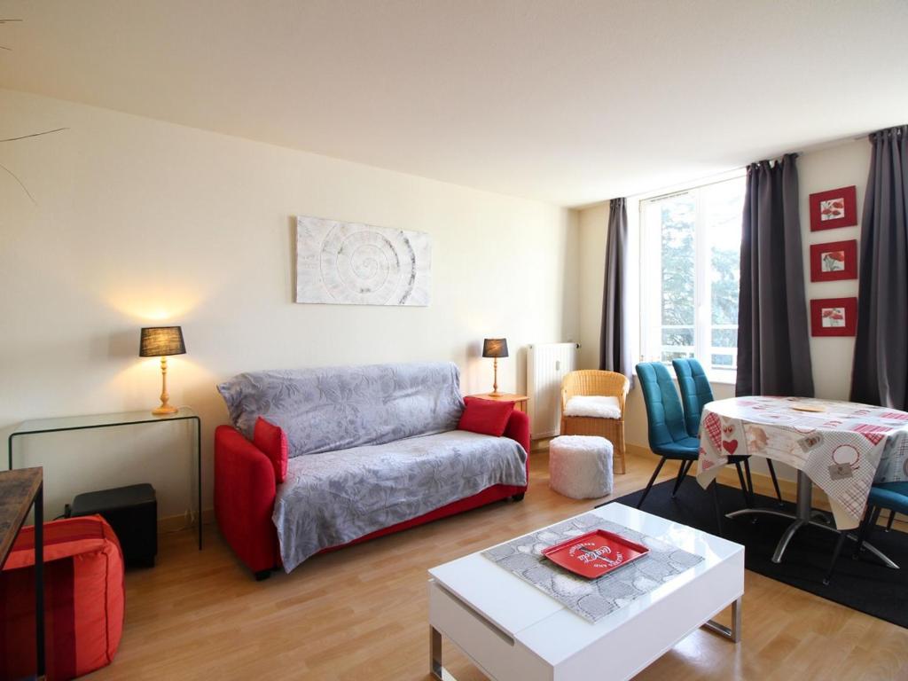 a living room with a couch and a table at Appartement La Bourboule, 2 pièces, 5 personnes - FR-1-608-243 in La Bourboule