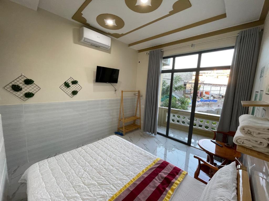 Giường trong phòng chung tại T'H Homestay