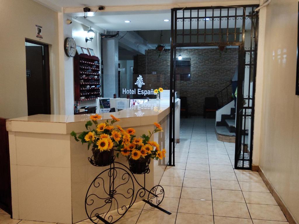 a flower shop with a counter with flowers on it at Hotel España in Guatemala