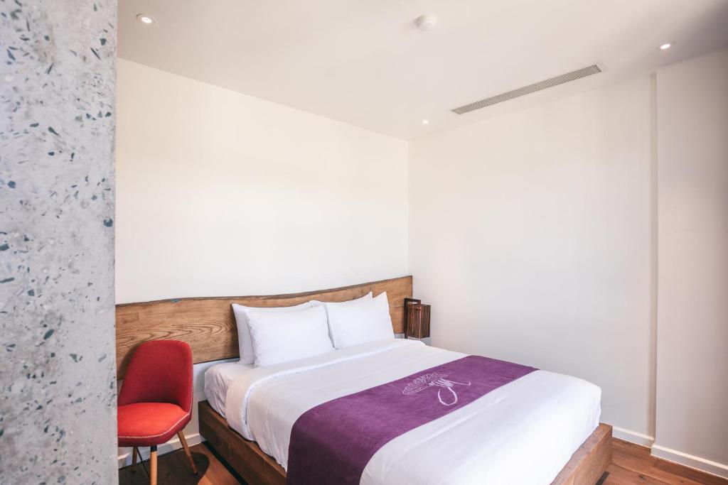 Giường trong phòng chung tại JM Boutique Hotel
