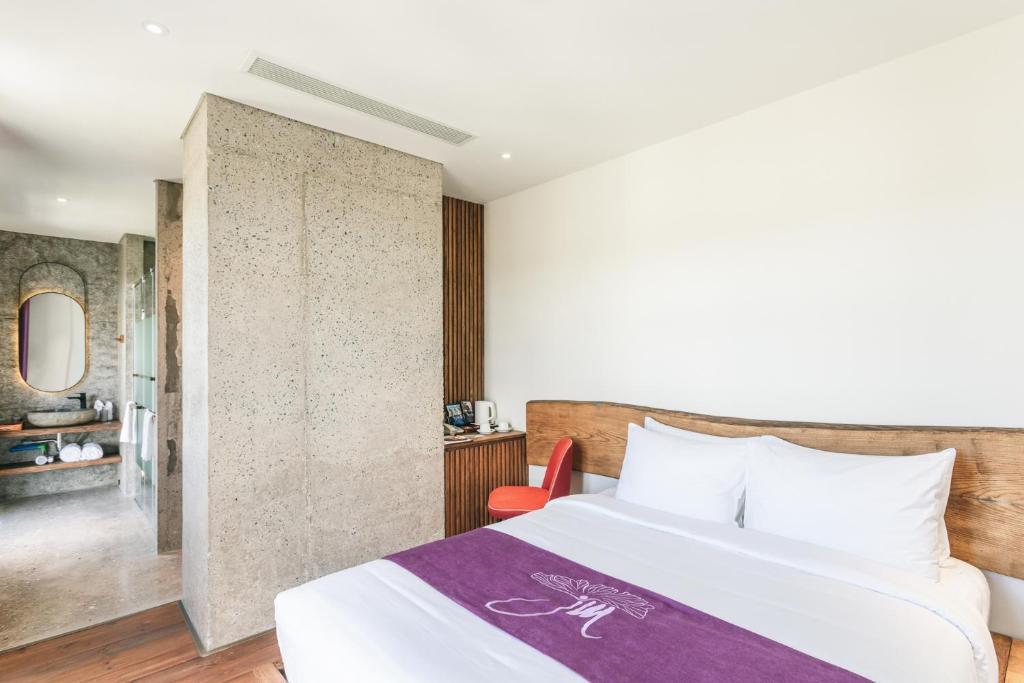 Giường trong phòng chung tại JM Boutique Hotel