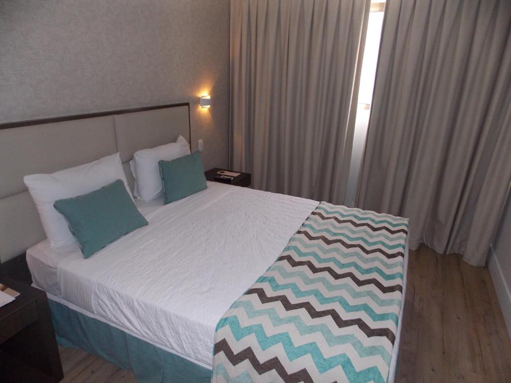 Кровать или кровати в номере Mirador Rio Copacabana Hotel