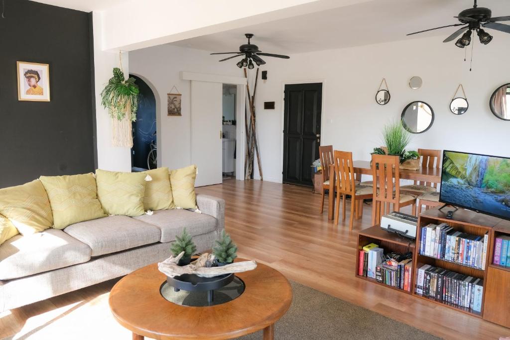 a living room with a couch and a table at Jonty Villa, Mazotos in Larnaka