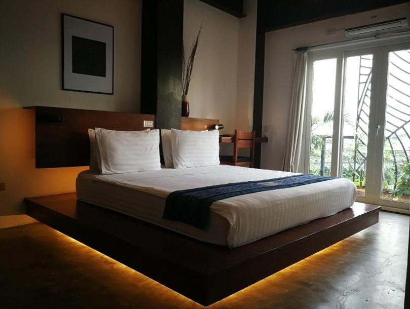 Postel nebo postele na pokoji v ubytování ELEMENT BOUTIQUE HOTEL