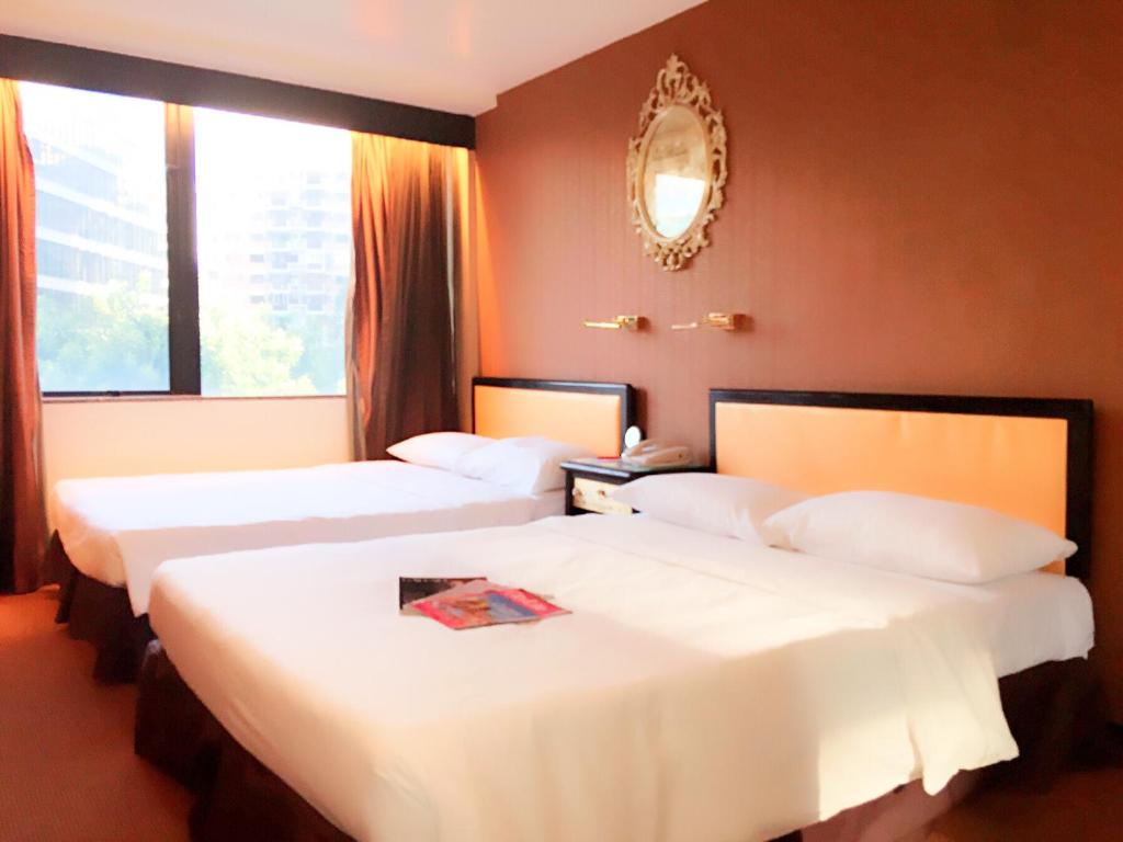 Ένα ή περισσότερα κρεβάτια σε δωμάτιο στο Best Western Plus Tsim Sha Tsui