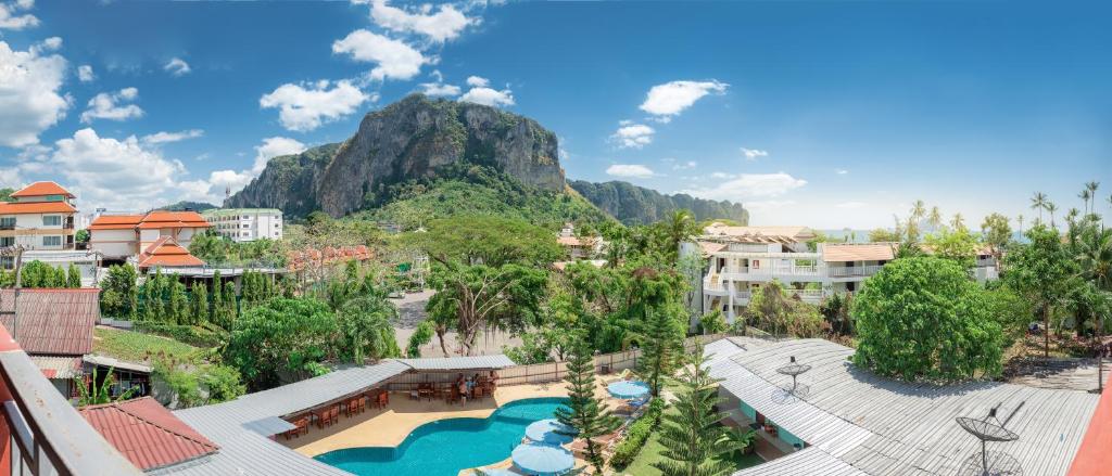 a view of a resort with a mountain in the background at The Palace Aonang Resort in Ao Nang Beach