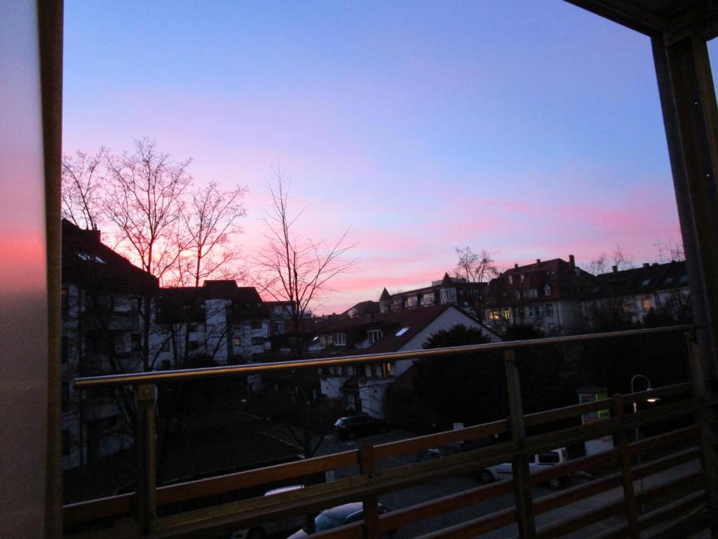 a view of a sunset from a balcony at Apartment Schultheiss in Konstanz