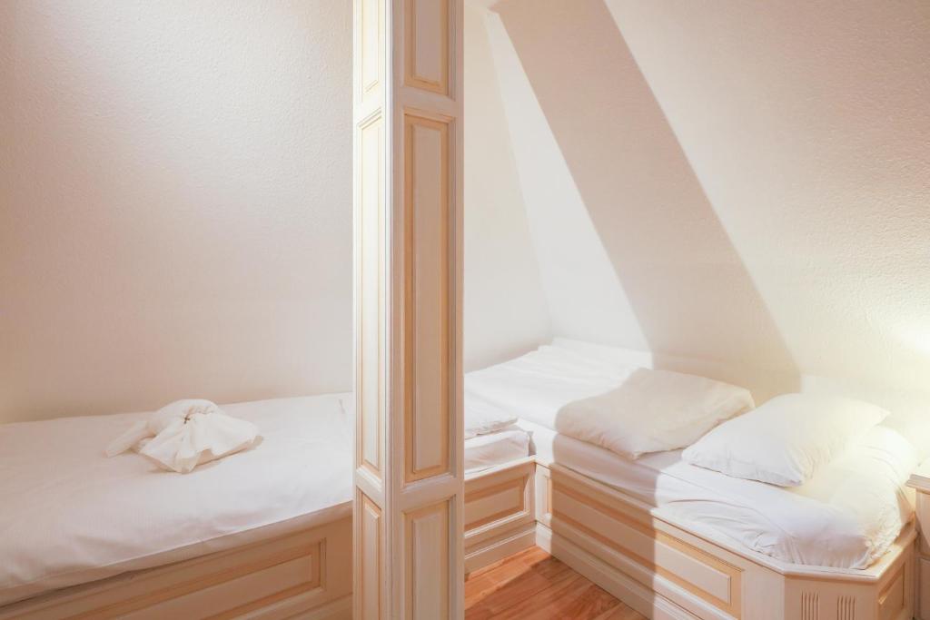 Postel nebo postele na pokoji v ubytování Lisbeth Hus - Anlage Ameland