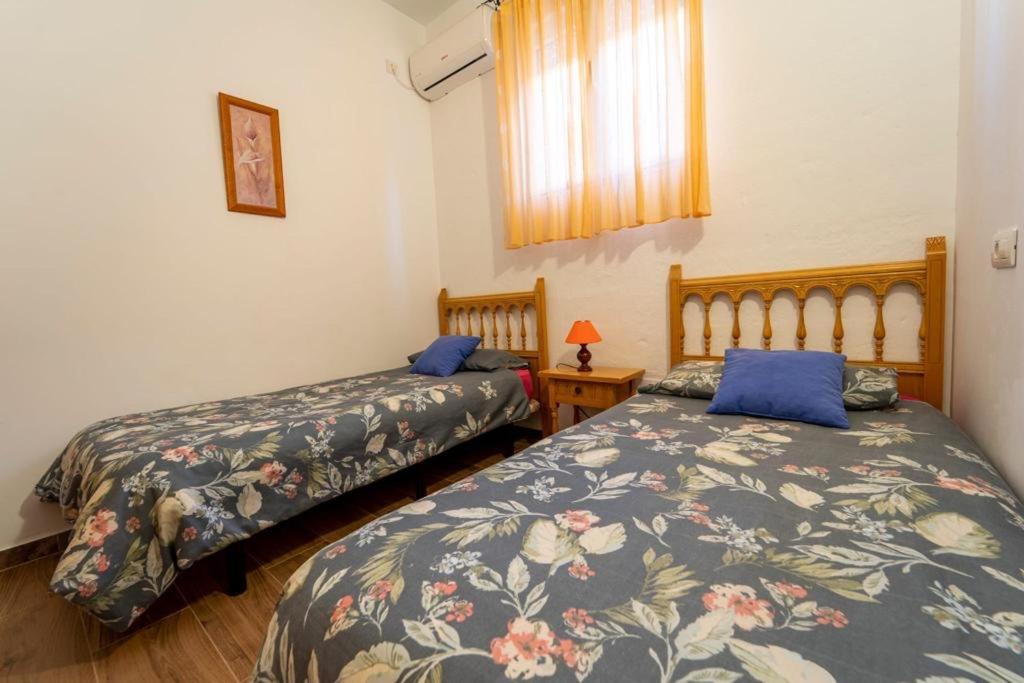 Postel nebo postele na pokoji v ubytování Villa Paulito El Roque