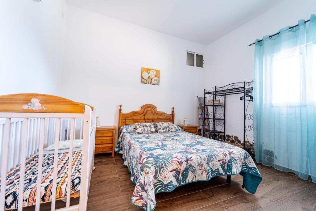 Postel nebo postele na pokoji v ubytování Villa Paulito El Roque