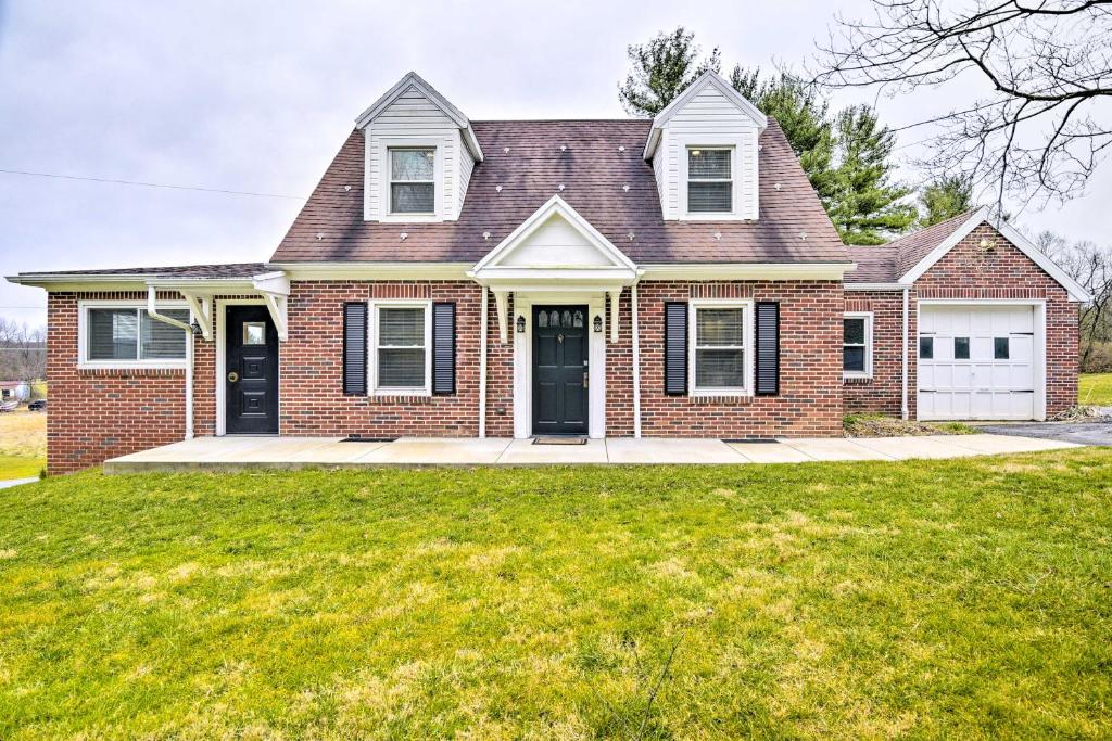 a brick house with a large lawn in front of it at Pennsylvania Vacation Rental Close to Hiking in York