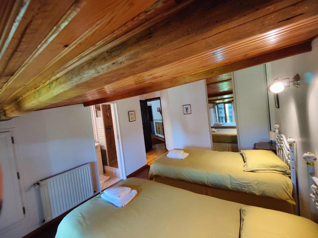 Łóżko lub łóżka w pokoju w obiekcie Chambres en maison d'hôtes Le Moulin d'Annepont