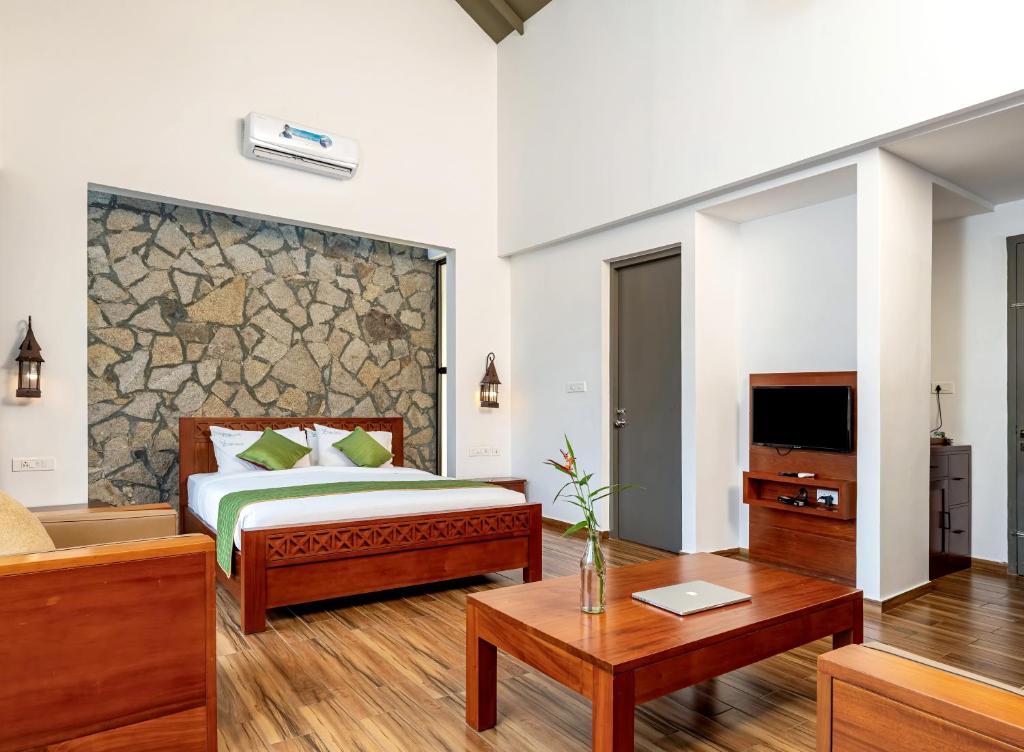 Postel nebo postele na pokoji v ubytování Coffee Greens Resort