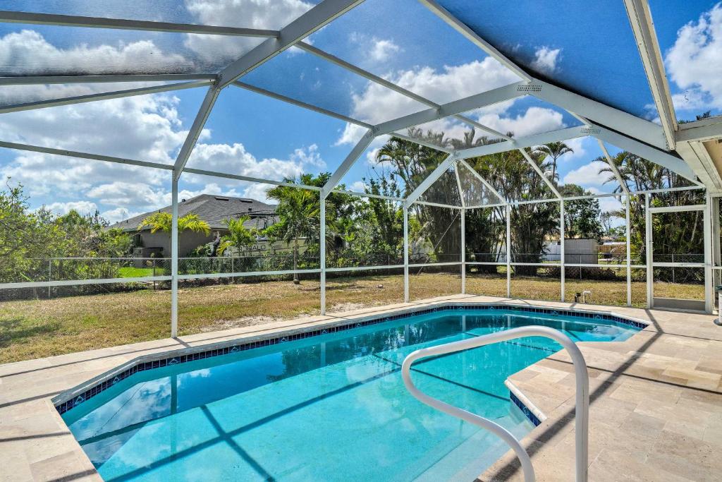 an indoor swimming pool with a glass roof at Cape Coral Vacation Rental with Private Pool! in Cape Coral