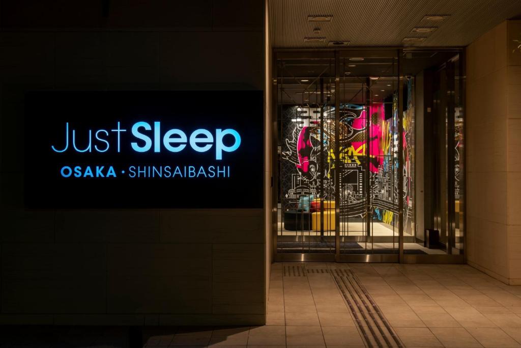 a sign that says just sleep in a building at Just Sleep Osaka Shinsaibashi in Osaka