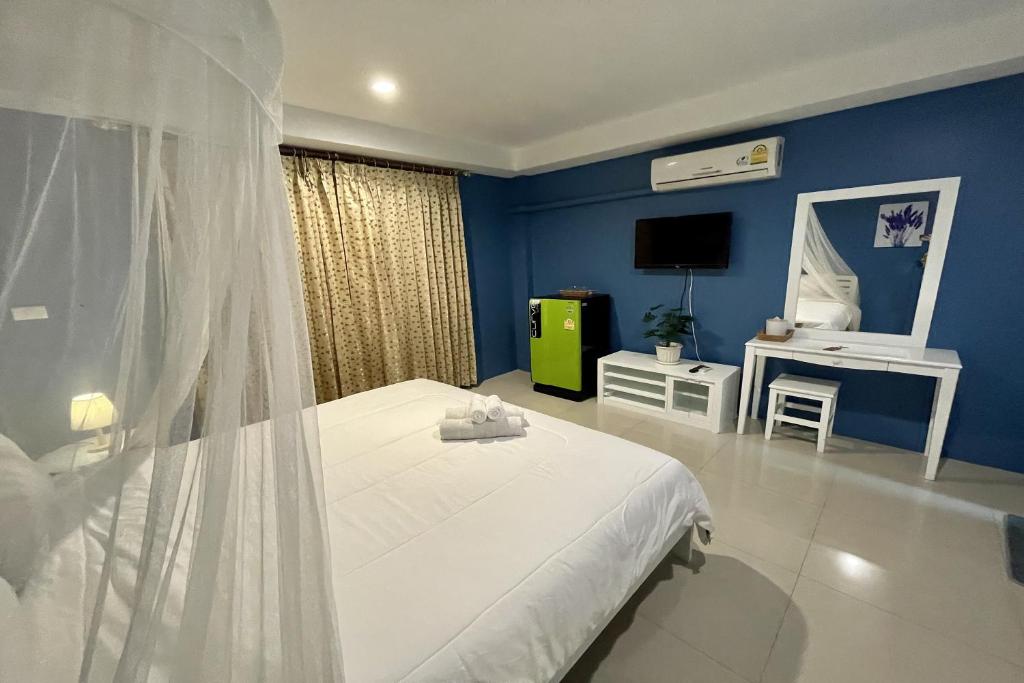 Postel nebo postele na pokoji v ubytování Be Rich Hotel