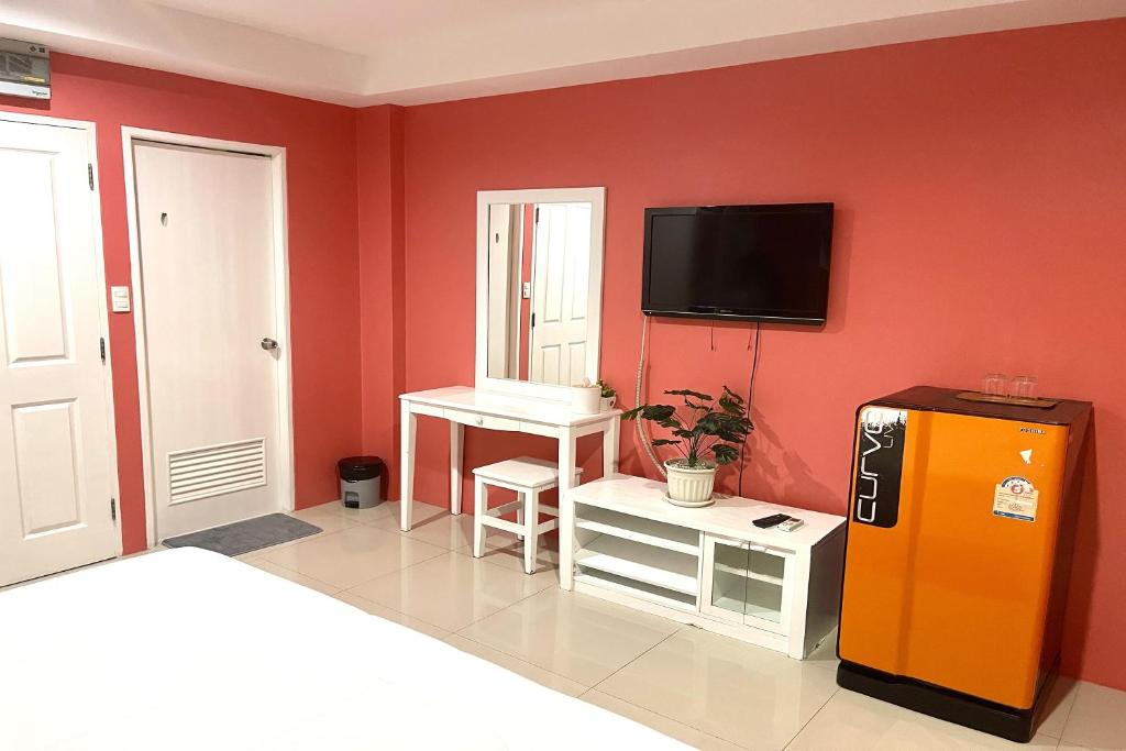 TV a/nebo společenská místnost v ubytování Be Rich Hotel