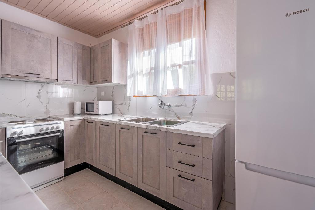 Kuchyň nebo kuchyňský kout v ubytování Salty Pebble House