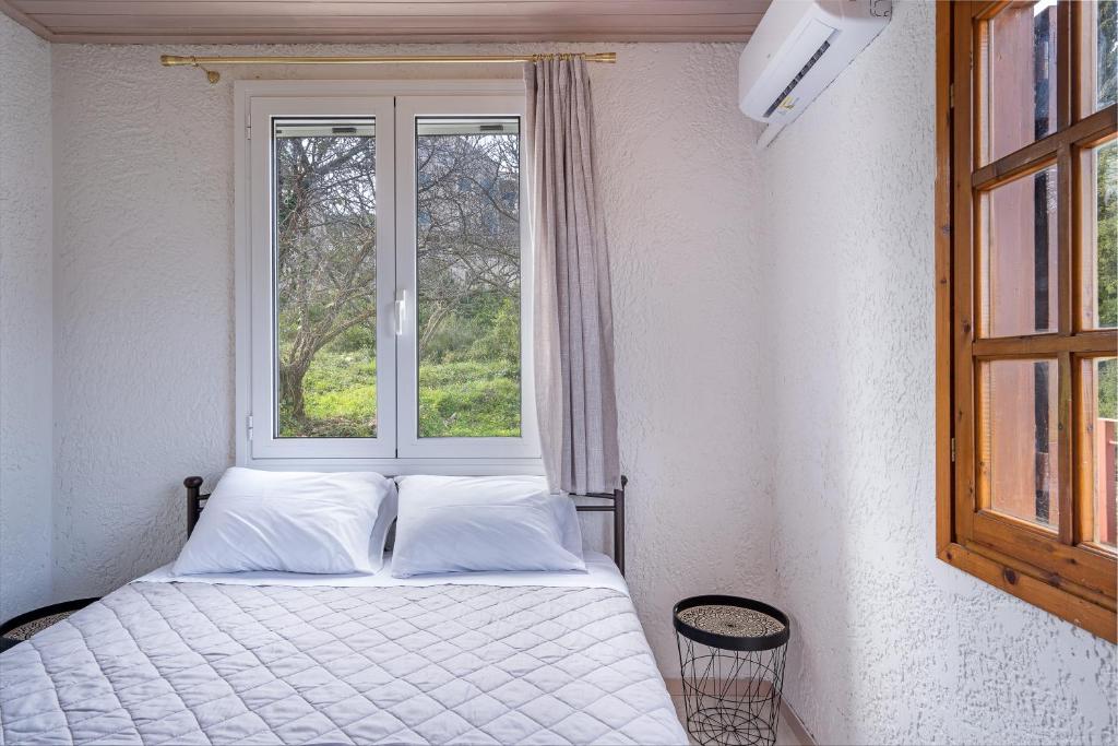 Postel nebo postele na pokoji v ubytování Salty Pebble House