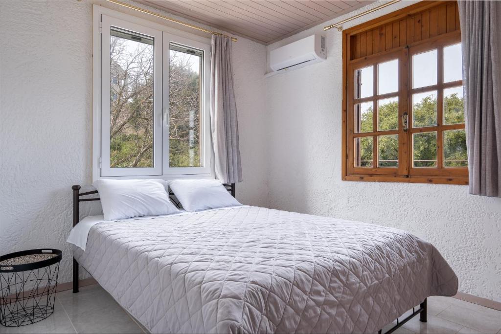 Postel nebo postele na pokoji v ubytování Salty Pebble House