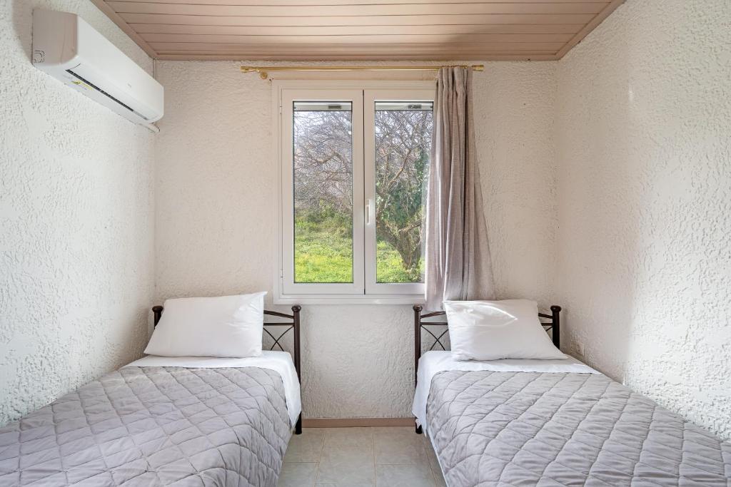 Postel nebo postele na pokoji v ubytování Salty Pebble House