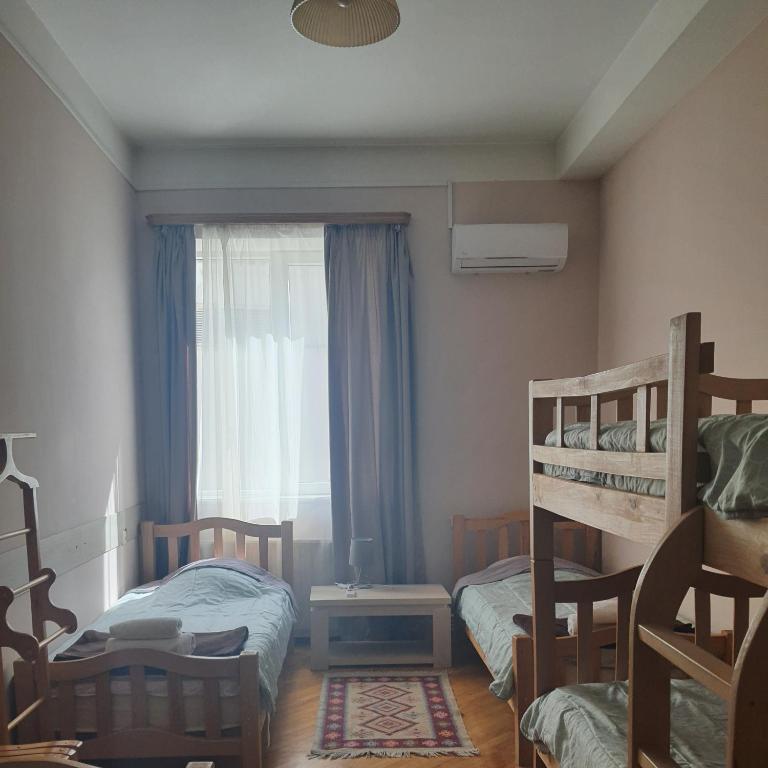 Postel nebo postele na pokoji v ubytování Guesthouse Hillside