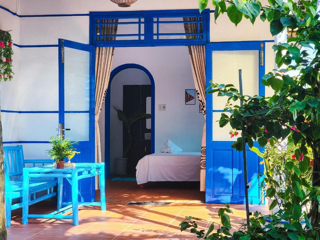 Postel nebo postele na pokoji v ubytování Dragon Sea Homestay