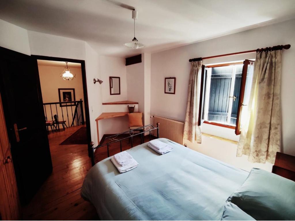 Łóżko lub łóżka w pokoju w obiekcie Chambres en maison d'hôtes Le Moulin d'Annepont
