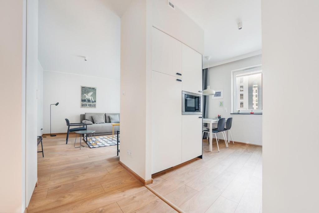 Televízia a/alebo spoločenská miestnosť v ubytovaní Apartamenty Sun & Snow Angielska Grobla