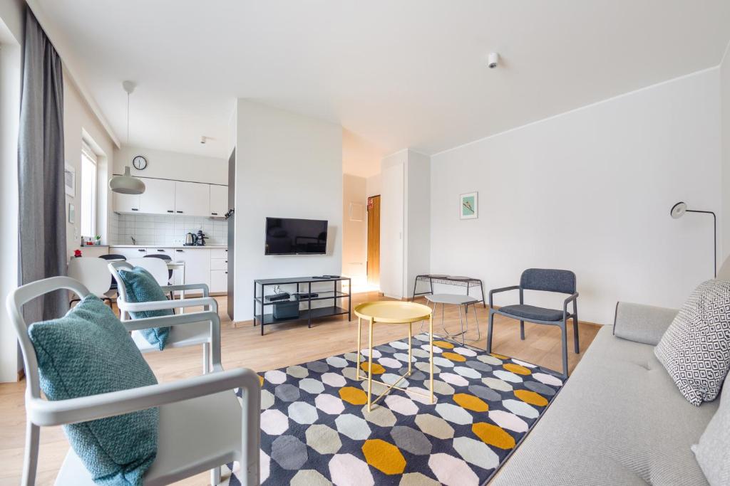 Televízia a/alebo spoločenská miestnosť v ubytovaní Apartamenty Sun & Snow Angielska Grobla