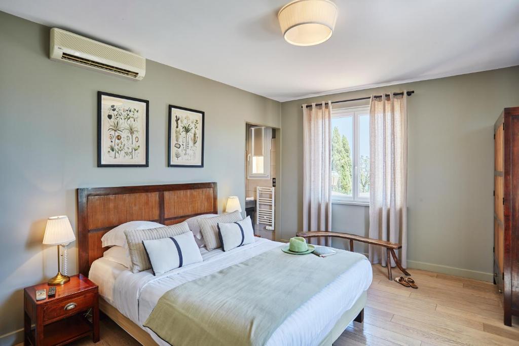 Postel nebo postele na pokoji v ubytování Hôtel de Charme Bello Visto