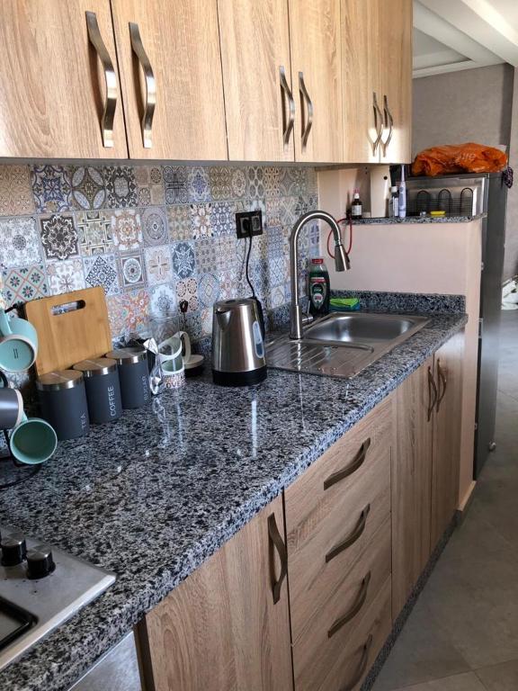 Kuchyň nebo kuchyňský kout v ubytování Agadir vibes en-suite rooms