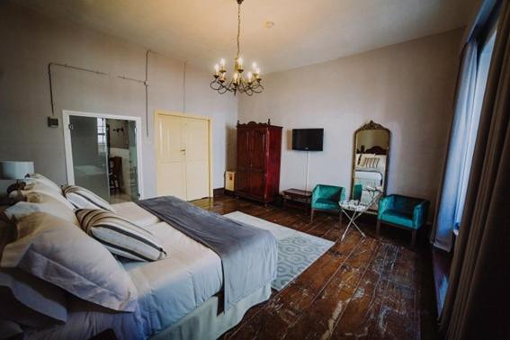 Łóżko lub łóżka w pokoju w obiekcie Hotel Aguere