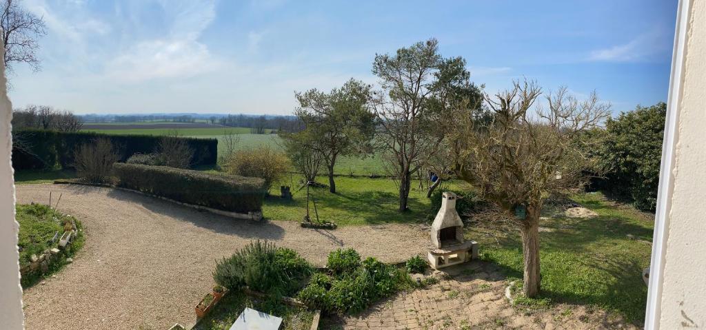 an aerial view of a garden with a tree at Maison de Ophelia in Périgné